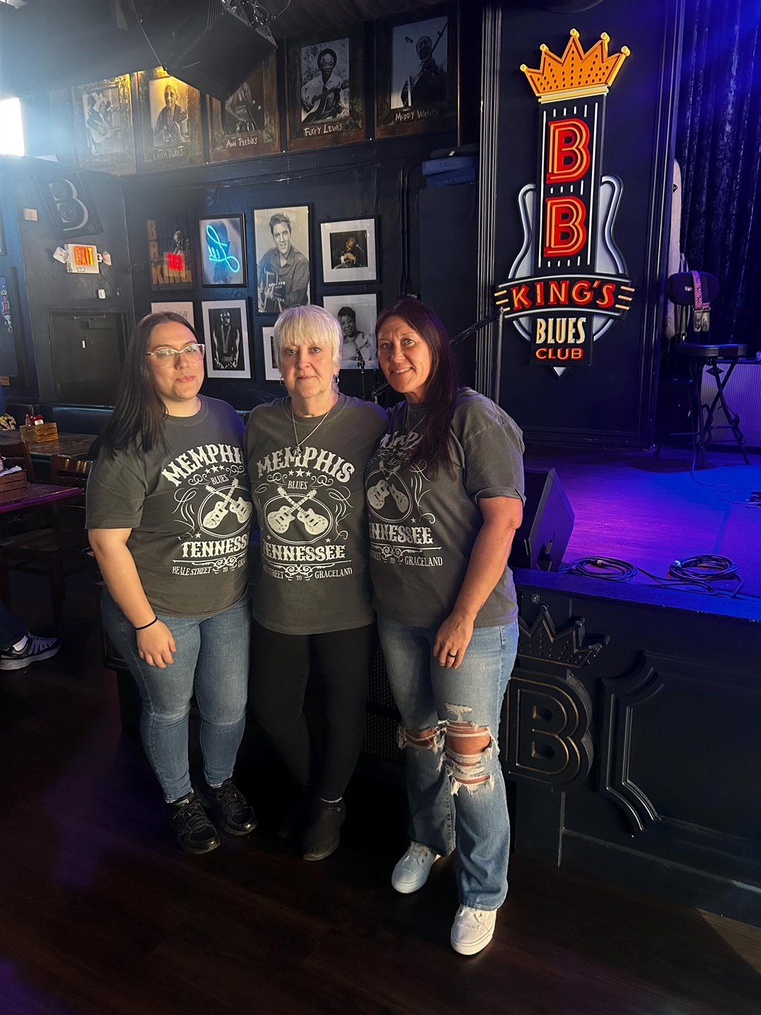 Three women in matching Memphis Tennessee tees at B.B. King's Blues Club on Beale Street